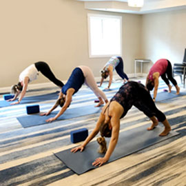 birthday weekend yoga in downward-facing dog pose